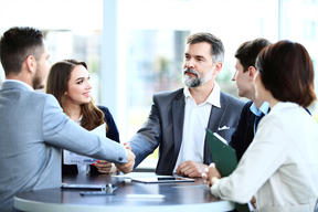 Are accepted offers binding in New York? shaking hands around a table