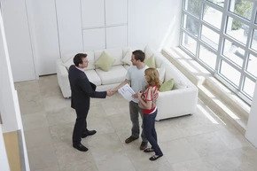 broker showing a coop apartment to potential clients in NYC