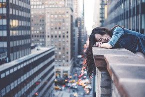 woman resting on a balcony: Buying and selling with a tenant in place