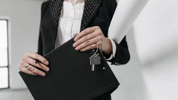 Agent holding keys after title work is complete