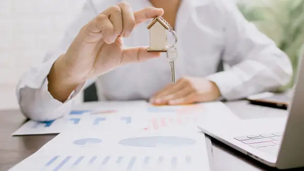Co-op buyer reviewing shares, lease and closing paperwork