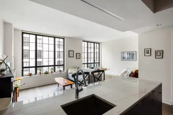 An alcove open to the main room, which is exactly what keeps it an alcove