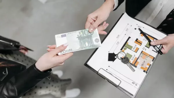 A signed contract beside the wire instructions for a buyer's escrow deposit