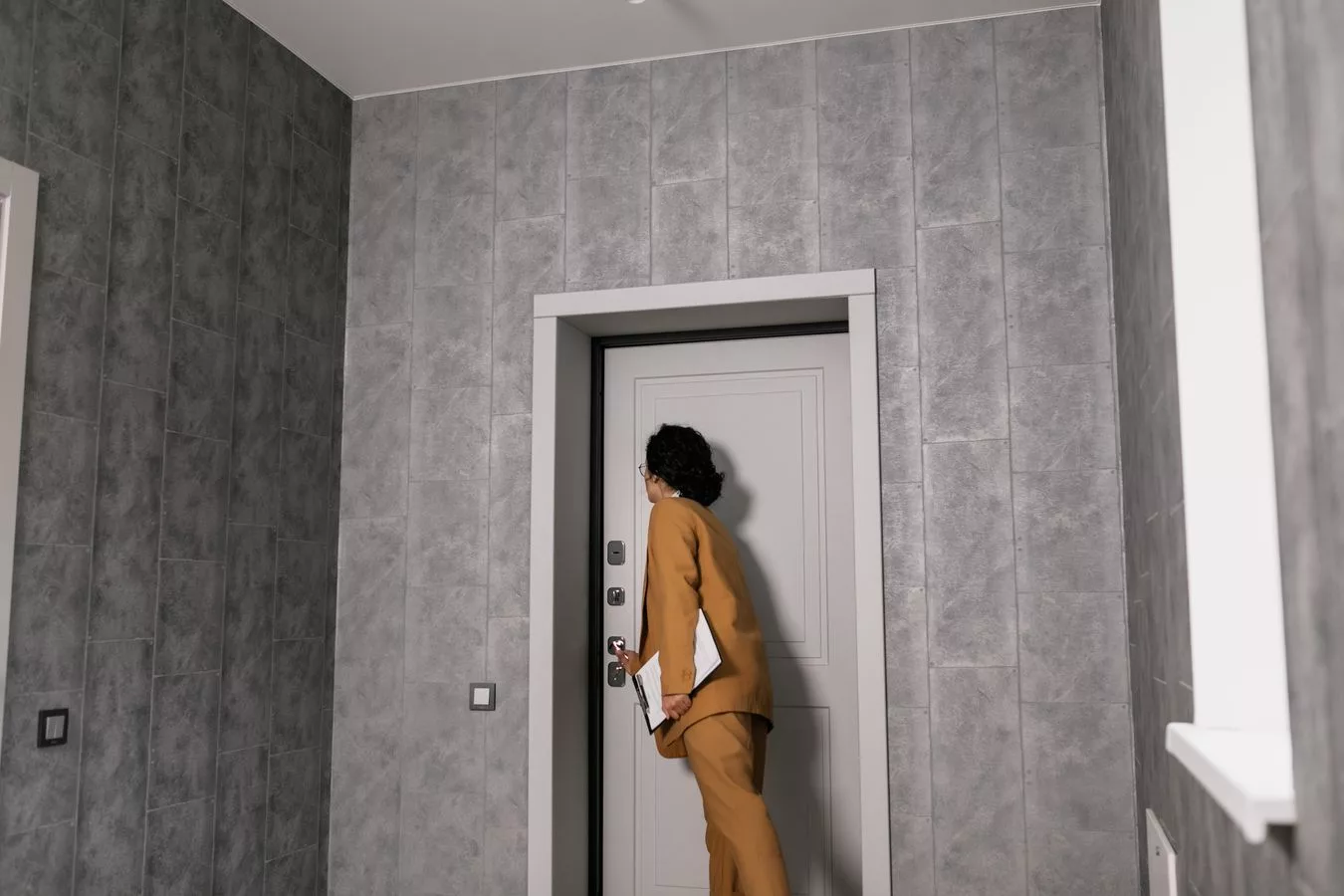 A buyer inspecting an NYC apartment during a walkthrough before making an offer