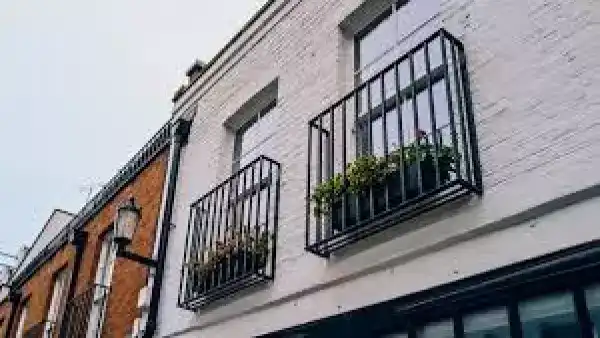 A Juliet balcony, which is outdoor space in the listing filters and a railing in real life