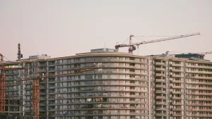 A large NYC residential building still under construction with a crane