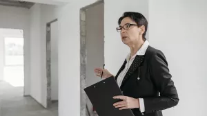 Pproperty managing agent - roperty manager reviewing a New York apartment building