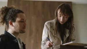 A couple reviewing a NYC apartment purchase contract