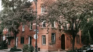 A small prewar apartment building on a quiet NYC block