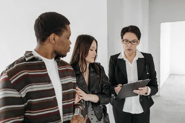 Family members reviewing a NYC co-op purchase with an attorney