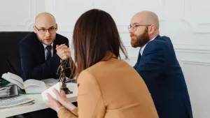 A buyer interviewing two real estate attorneys at their office - new york state disclosure form for buyer and seller