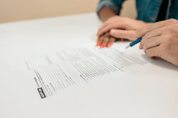 A NYC buyer signing a co-op purchase contract with their attorney
