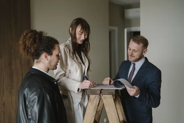 A NYC buyer and their agent preparing an offer on an apartment