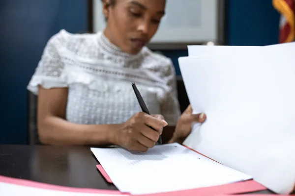 A NYC buyer reviewing a mortgage commitment letter with their attorney