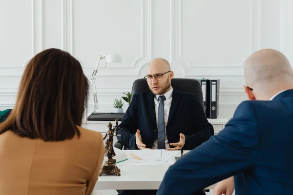 A buyer and their attorney reviewing a mortgage contingency clause in a NYC purchase contract