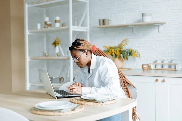 A NYC buyer reviewing a mortgage pre-approval letter at a kitchen table