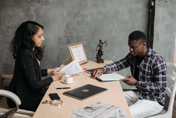 A NYC buyer and their attorney going through a co-op board package and contract of sale