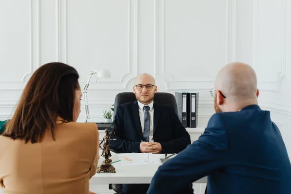 A NYC buyer and their attorney reviewing a signed purchase contract